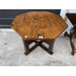 A HAND CARVED OCTAGONAL OAK OCCASIONAL TABLE