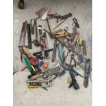 A LARGE QUANTITY OF HAND TOOLS TO INCLUDE SCREW DRIVERS, PLIERS, SCISSORS ETC.