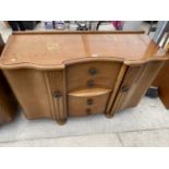 AN OAK SIDEBOARD WITH TWO DOORS AND FOUR DRAWERS