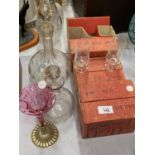 A SELECTION OF MID CENTURY MEDICI SHERRY AND LIQUEUR GLASSES WITH TWO DECANTERS AND A CRANBERRY