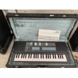 A YAMAHA PORTA SOUND PSS-570 KEYBOARD TO INCLUDE A CARRY CASE