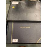 A BOXED LEATHER BOUND UNUSED CELLAR BOOK FOR RECORDING WINE COLLECTION INFORMATION