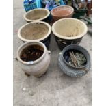 A BRONZE PLANTER AND FIVE STONEWARE PLANTERS