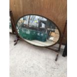 AN OVAL INLAY PIVOT DRESSING TABLE MIRROR