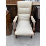 A 19TH CENTURY OAK FIRESIDE CHAIR ON X FRAME WITH SWEPT BACK AND BRASS CASTERS