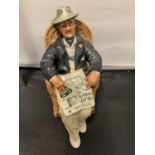 A ROYAL DOULTON FIGURINE TAKING THINGS EASY HN 2677