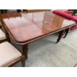A VICTORIAN MAHOGANY WIND-OUT DINING TABLE ON TURNED AND FLUTED LEGS, 54x39" EXTENDED