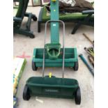 TWO GARDEN SEED SOWERS AND FURTHER HAND HELD SPREADER