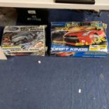 TWO BOXES OF SCALEXTRIC TO INCLUDE FORD ESCORT XR3I AND DRIFT KINGS