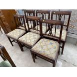 A SET OF SIX 19TH CENTURY MAHOGANY DINING CHAIRS WITH WOOLWORK DROP-IN SEATS