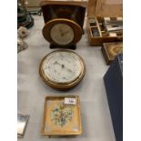 THREE VINTAGE CLOCKS AND A BAROMETER TO INCLUDE A VINTAGE ALARM CLOCK WITH AN EMBROIDERED FACE