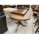 A MAHOGANY EXTENDING DINING TABLE ON TWIN PEDESTAL SUPPORTS