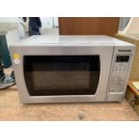 A SILVER PANASONIC 700W NN-E2995 MICROWAVE