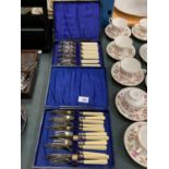 TWO CASED SETS IF FISH KNIVES AND FORKS