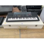 A YAMAHA PORTASOUND PSS-280 KEYBOARD TO INCLUDE WOODEN HINGED BOX AND MIXED MUSIC BOOKS