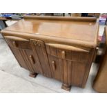 AN OAK SIDEBOARD WITH TWO DOORS AND TWO DRAWERS