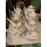 A GROUP OF NINE TEA AND COFFEE POTS TO INCLUDE ROYAL ALBERT, PARAGON AND WEDGWOOD