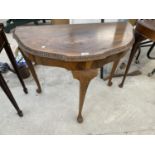 A WALNUT DEMI LUNE HALL TABLE