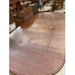 A VICTORIAN MAHOGANY WIND-OUT DINING TABLE WITH TWO EXTRA LEAVES, ON CABRIOLE LEGS WITH BALL AND