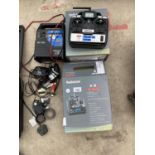 A BATTERY CHARGER, TWO RADIO LINK T6 SERIES CONTROLLERS ETC.