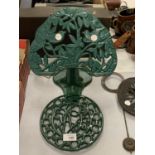 A GREEN CAST METAL TRIVET AND A GREEN METAL RECIPE BOOK HOLDER