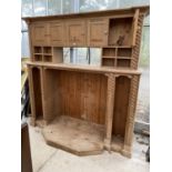 A LARGE PINE ENTERTAINMENT UNIT WITH SHELVES, CUPBOARDS WITH APPLIED BARLEYTWIST DECORATION 82"