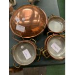 A VINTAGE COPPER WOK AND TWELVE BRASS AND COPPER BALTI DISHES