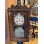 AN ORNATE VINTAGE WOODEN WALL CLOCK WITH GOLD DETAIL