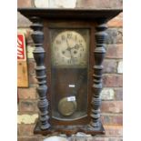 A VINTAGE ORNATE WOODEN WALL CLOCK