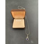 SILVER MARKED BLUE PASTE AND MARCASITE TEARDROP PENDANT AND CHAIN. APPROX TOTAL WEIGHT 5 GRAMS