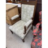 A LATE VICTORIAN UPHOLSTERED FIRESIDE CHAIR