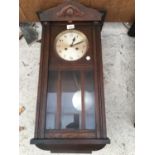 A WALL PENDULUM CLOCK