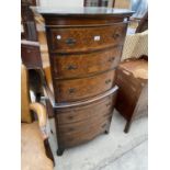 A REPRODUCTION WALNUT CHEST ON CHEST ENCLOSING SIX DRAWERS AND DRESSING SLIDE, 25.5" WIDE