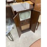 A VINTAGE BUSH TV IN CABINET, TYPE TUG 24