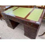 A REPRODUCTION MAHOGANY TWIN PEDESTAL DESK ENCLOSING NINE DRAWERS, HAVING THREE SECTION INSET