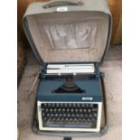 A VINTAGE ERIKA TYPEWRITER COMPLETE WITH ORIGINAL CASE