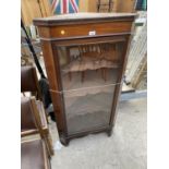 AN INLAID MAHOGANY CORNER CABINET WITH SINGLE GLAZED DOOR