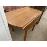 A MODERN TEAK DROP-LEAF TABLE