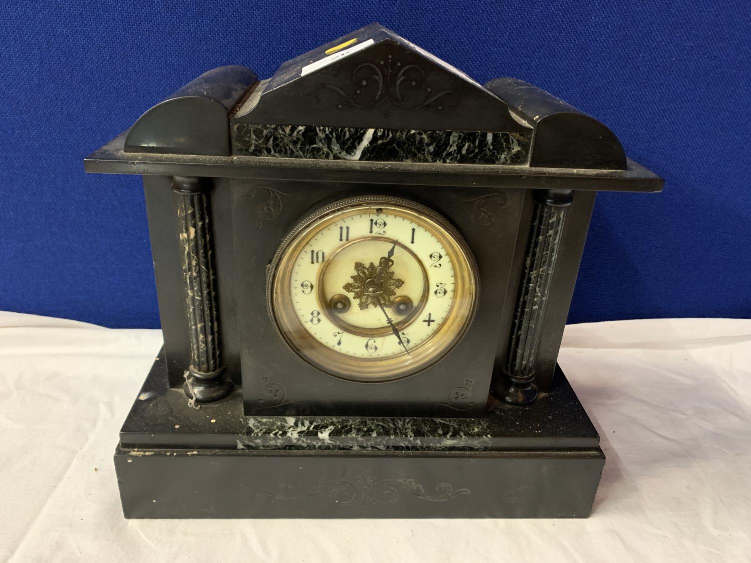 A VINTAGE POLISHED SLATE AND MARBLE MANTLE CLOCK