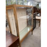 A SATINWOOD DISPLAY CABINET WITH TWO GLAZED SIDE DOORS