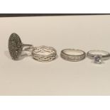 FOUR VARIOUS SILVER RINGS