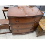 A BOW FRONT MAHOGANY CHEST OF THREE DRAWERS