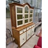 A CONTINENTAL KITCHEN DRESSOR WITH GLAZED UPPER PORTION CUPBOARDS AND DRAWERS TO THE BASE, 63" WIDE