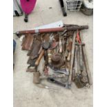 A LARGE COLLECTION OF TOOLS TO INCLUDE SAWS, HAMMERS, OIL CANS ETC.