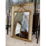 A 19TH CENTURY GILT FRAMED WALL MIRROR WITH INSEST PLASTER OVAL, DEPICTING CHERUBS, 59x41"