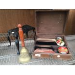 A 'CHURCH'S' VINTAGE SHOE POLISHING BOX WITH CONTENTS, A BRASS BELL AND A CAST IRON TRIVET