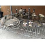 A LARGE COLLECTION OF METAL WARE TO INCLUDE TRAYS, TEA POT, CANDLE HOLDER ETC.