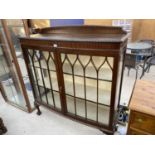 A MAHOGANY DISPLAY CABINET ON CABRIOLE SUPPORTS WITH TWO GLAZED DOORS