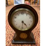 A WOODEN CARRIAGE CLOCK WITH INLAY DETAIL