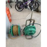 TWO HOSE PIPES ON REELS WITH A TROLLEY